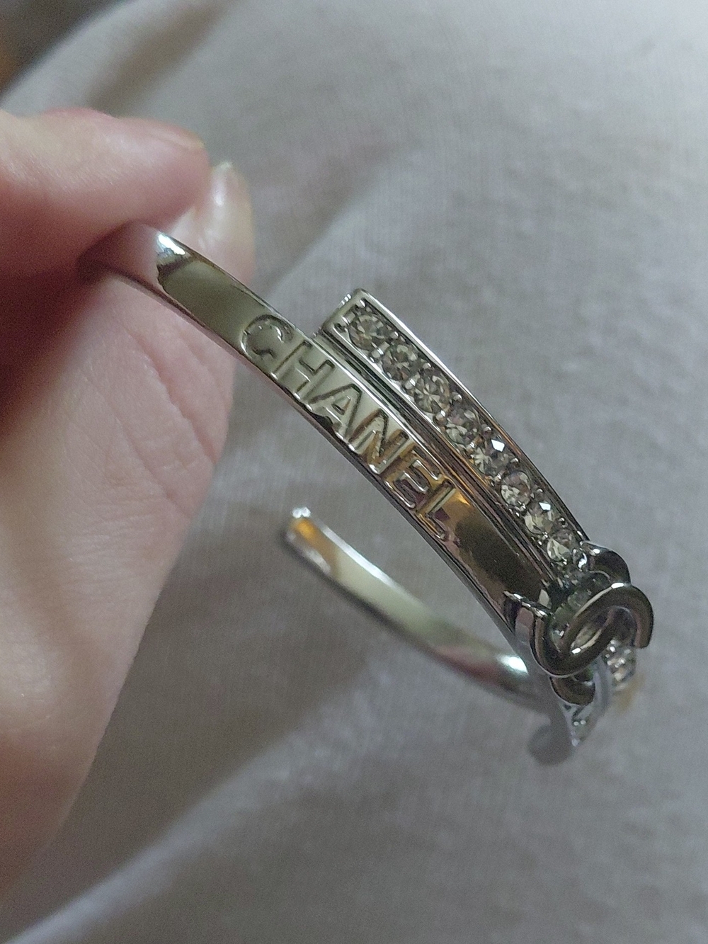 CHANEL Silver Crystal Row Logo Cuff Bracelet